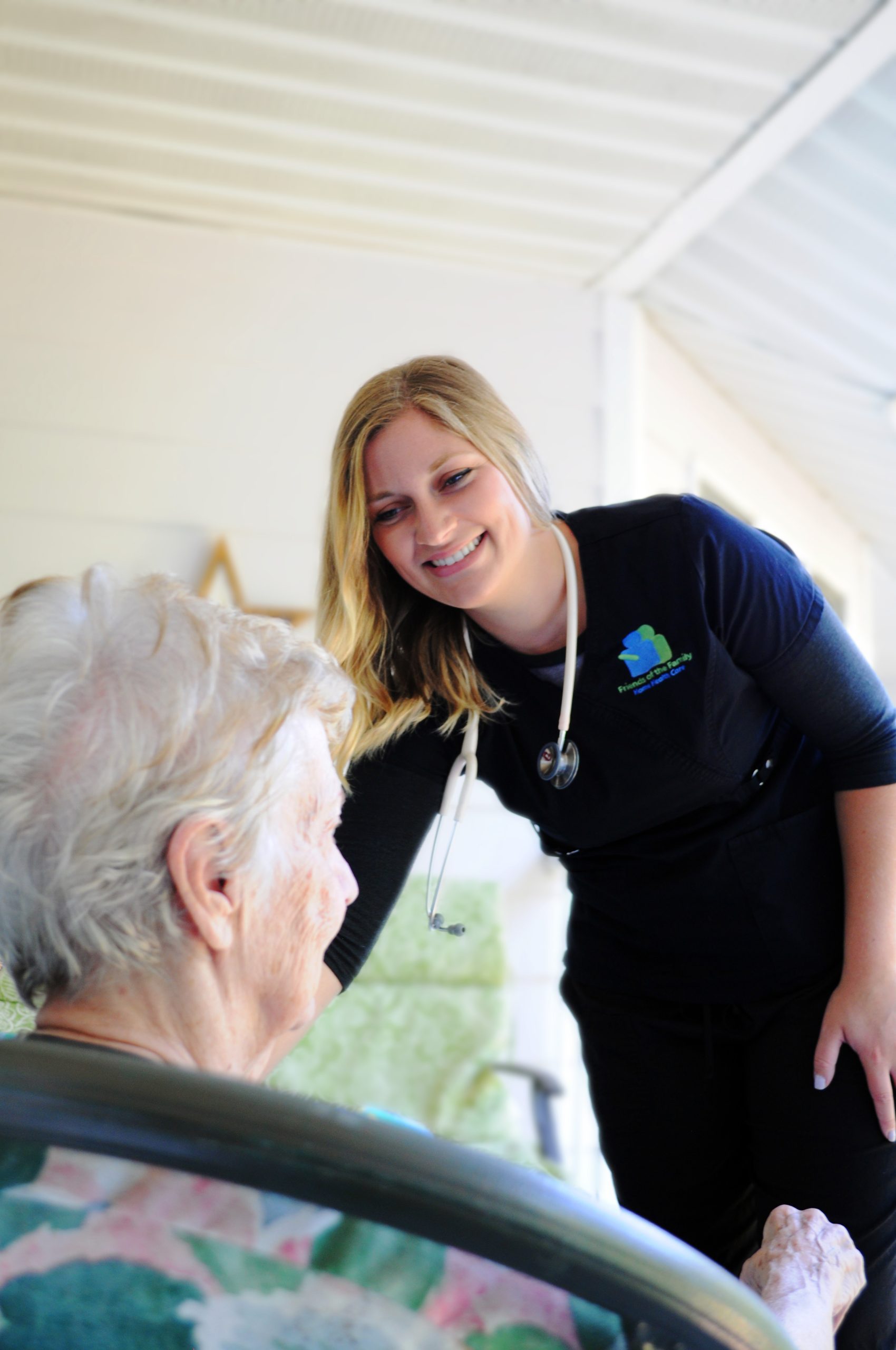 Friends of the Family Home Health Care Aide assisting elderly companion care patient with personal hygiene.